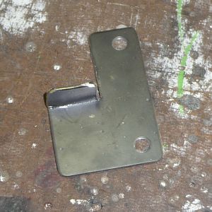 New exhaust clamp mount bracket.