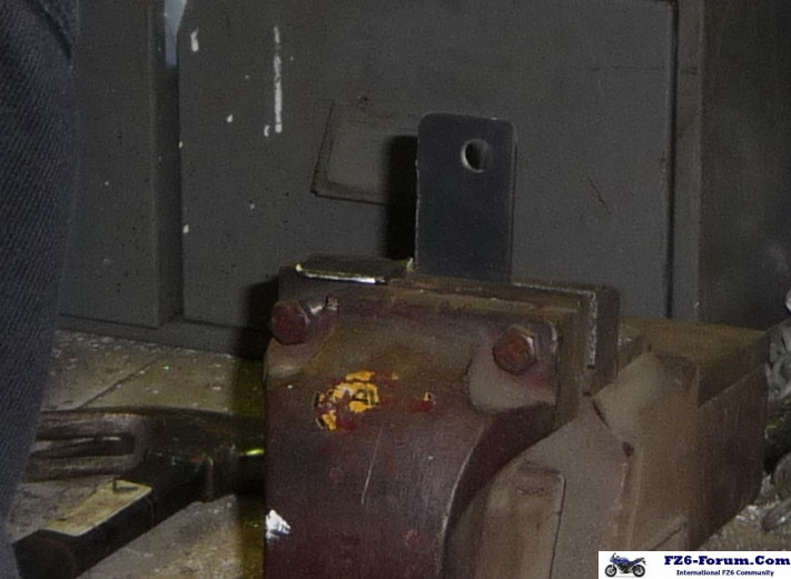 New exhaust clamp mount bracket.