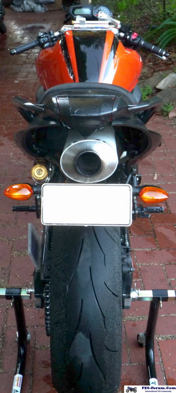 Single Pipe, with modified seat under seat area, and Exhaust surround